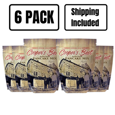 The front of six 2.5 lb. bags of Cooper's Best Buttermilk Pancake Mix on a white background with 6 pack and shipping included text at top