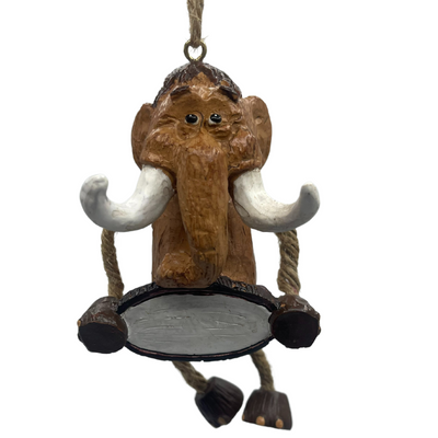Wooly Mammoth ornament with jute-rope legs, large tusks and holding a blank sign, shown on a white background