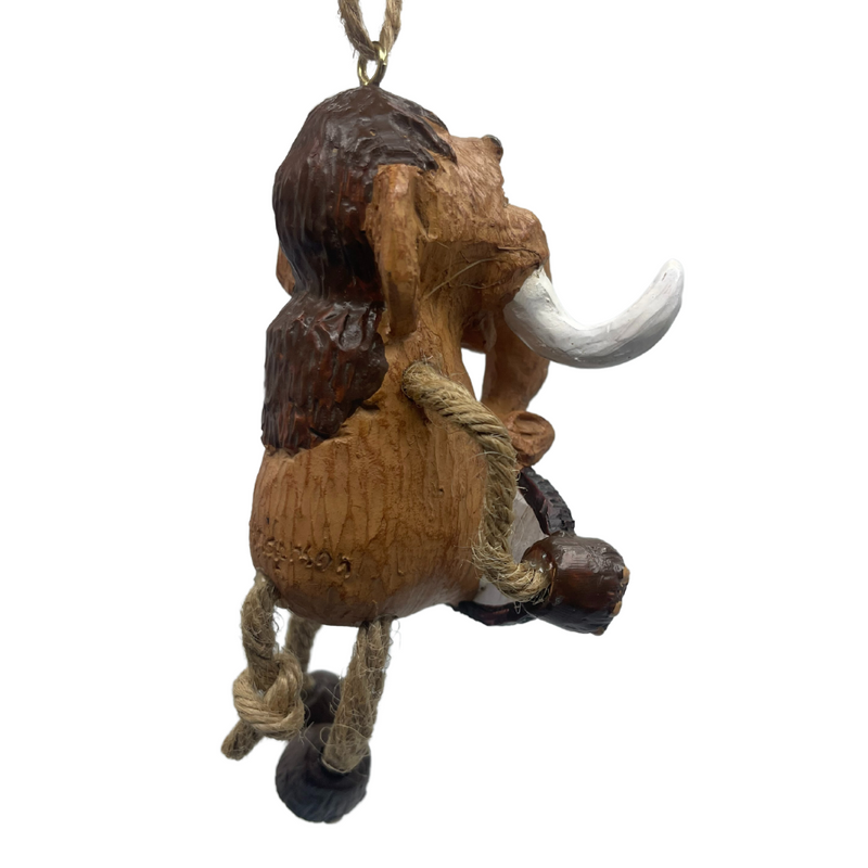 View of the back of wooly mammoth ornament with jute-ropoe legs and large tusks