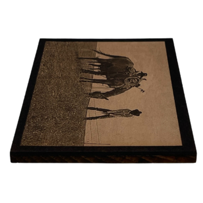 A Side Angle Of A Wood Printed Photograph Of Two Cowboys Playing Golf In A Field Alongside A Grazing Horse