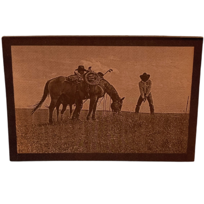 Image Of Two Cowboys Golfing Alongside A Horse Grazing 