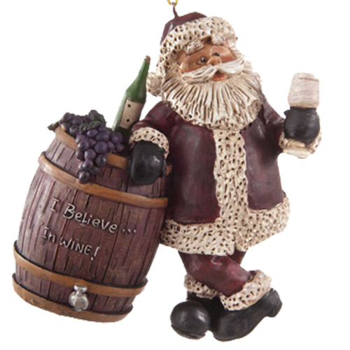 Ornament of Santa holding a wine glass and leaning on a wine barrel that has a bottle of wine , bunch of grapes sitting on top, shown on a white background