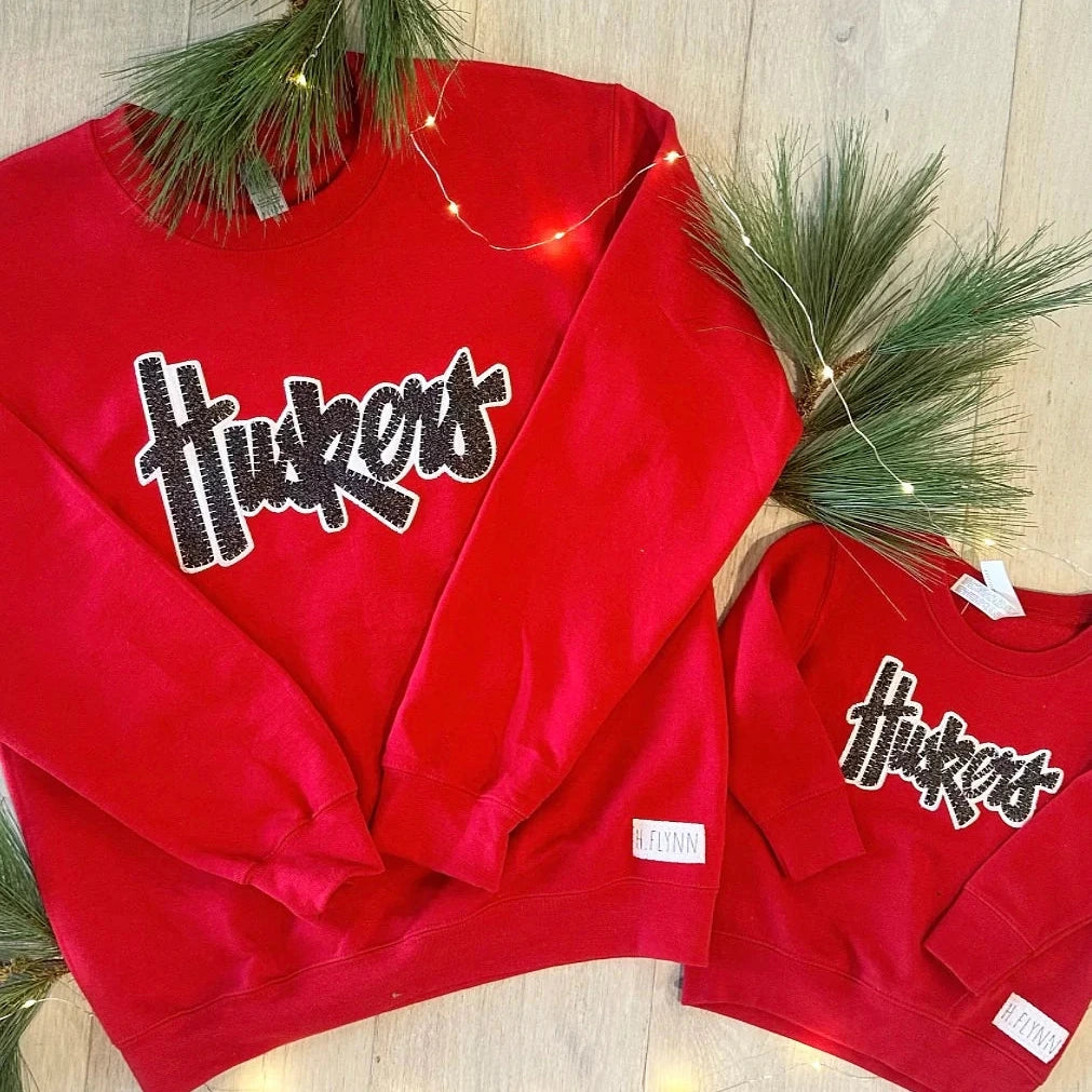 Huskers Sewn Appliqué Black Sparkle Red Licensed Toddler Crewneck Sweatshirt | Multiple Sizes | H.Flynn Designs