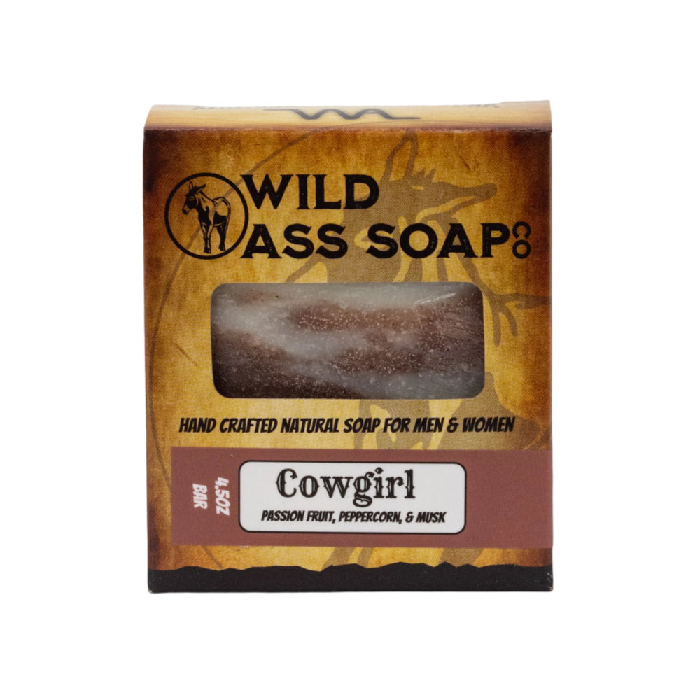 A packaged bar of Tallow Bar Soap with a label indicating it is Cowgirl Scent, 4.5 oz, Palm Oil & Paraben Free, handcrafted by Wild Ass Soap Co.