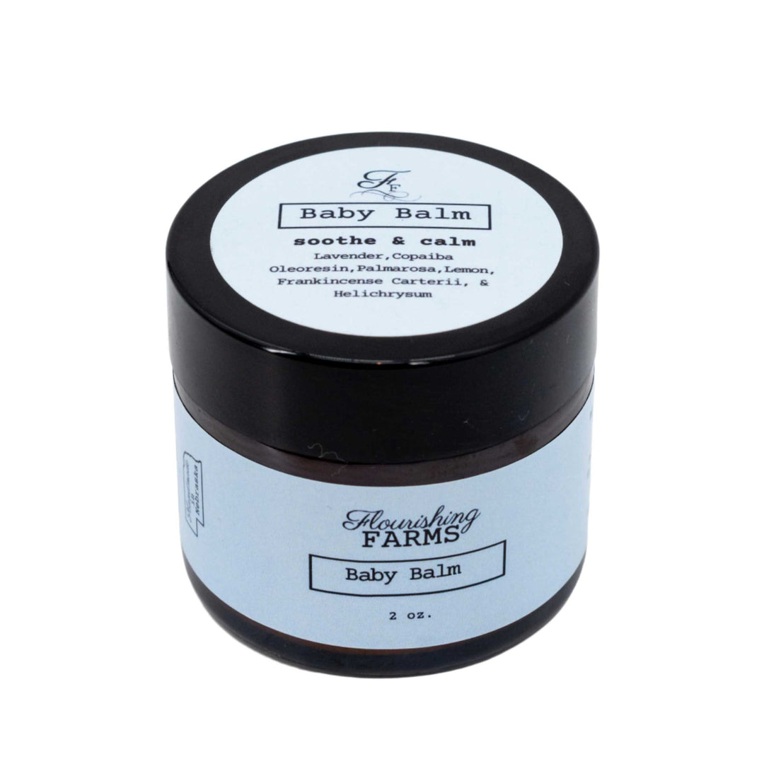 Flourishing Farms Baby Balm jar with black lid on a white background