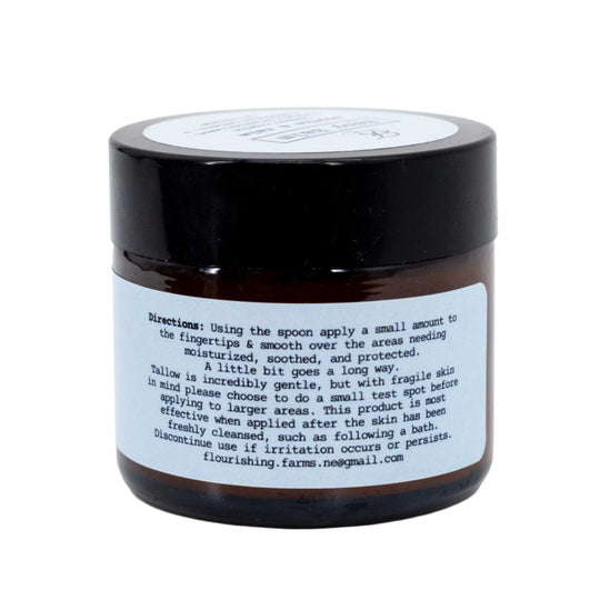 Black jar with a white label on a white background