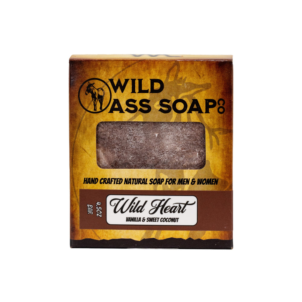 A bar of soap with a burgundy and black design, packaging includes the text 'WILD HEART' and 'WILD AS SOAP CO', indicating it is a natural soap for men and women.