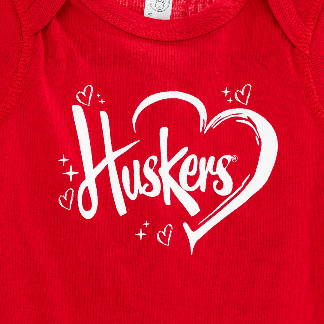 Infant Huskers Heart Onesie | Red | Multiple Sizes | Lou's Sporting Goods | 24N7IC