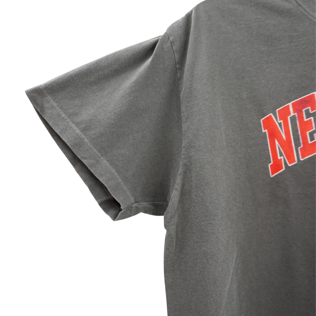 Gray t-shirt with red text on a white background