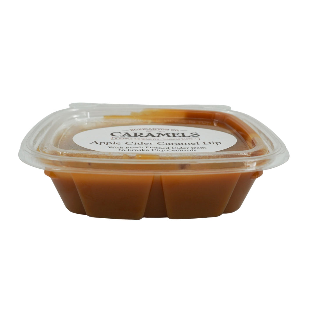 Container of Apple Cider Caramel Dip with a label on a white background