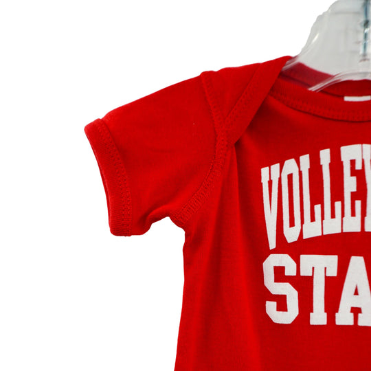 Red baby onesie with 'Volley State' text on a clear hanger against a white background