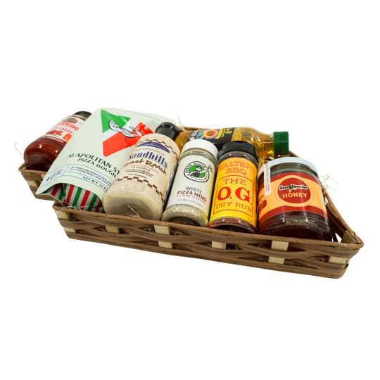 Assorted Nebraska food products in a wooden basket on a white background