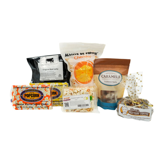 Assorted snack items including popcorn, jerky, caramels and toffee on a white background