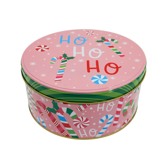 Round Christmas-themed tin with candy cane design on a white background