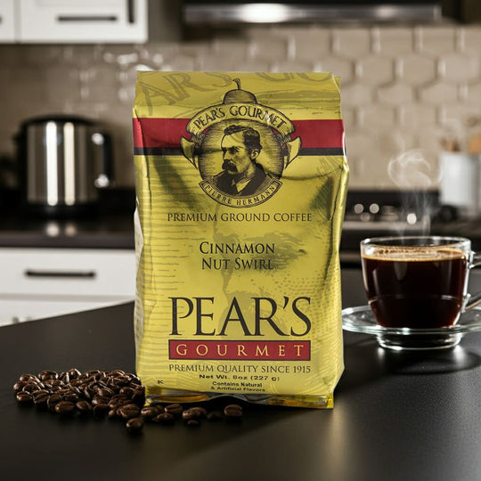 Pear's Gourmet coffee package on a kitchen counter with coffee beans and a cup of coffee.