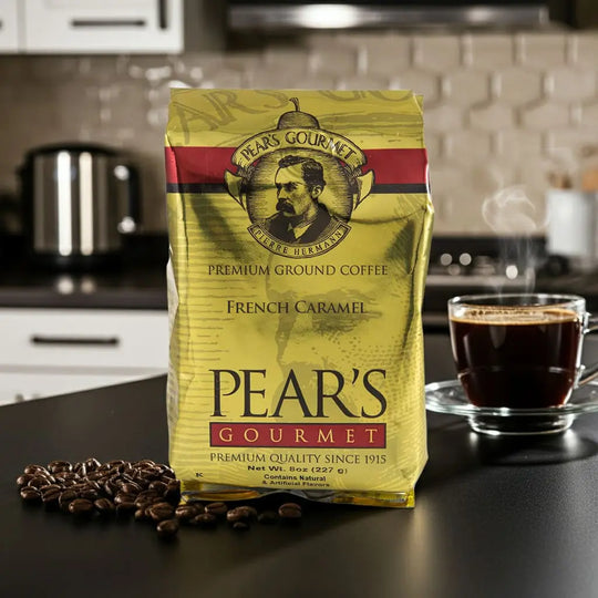 Pear's Gourmet coffee package with a cup of coffee and coffee beans on a kitchen counter.