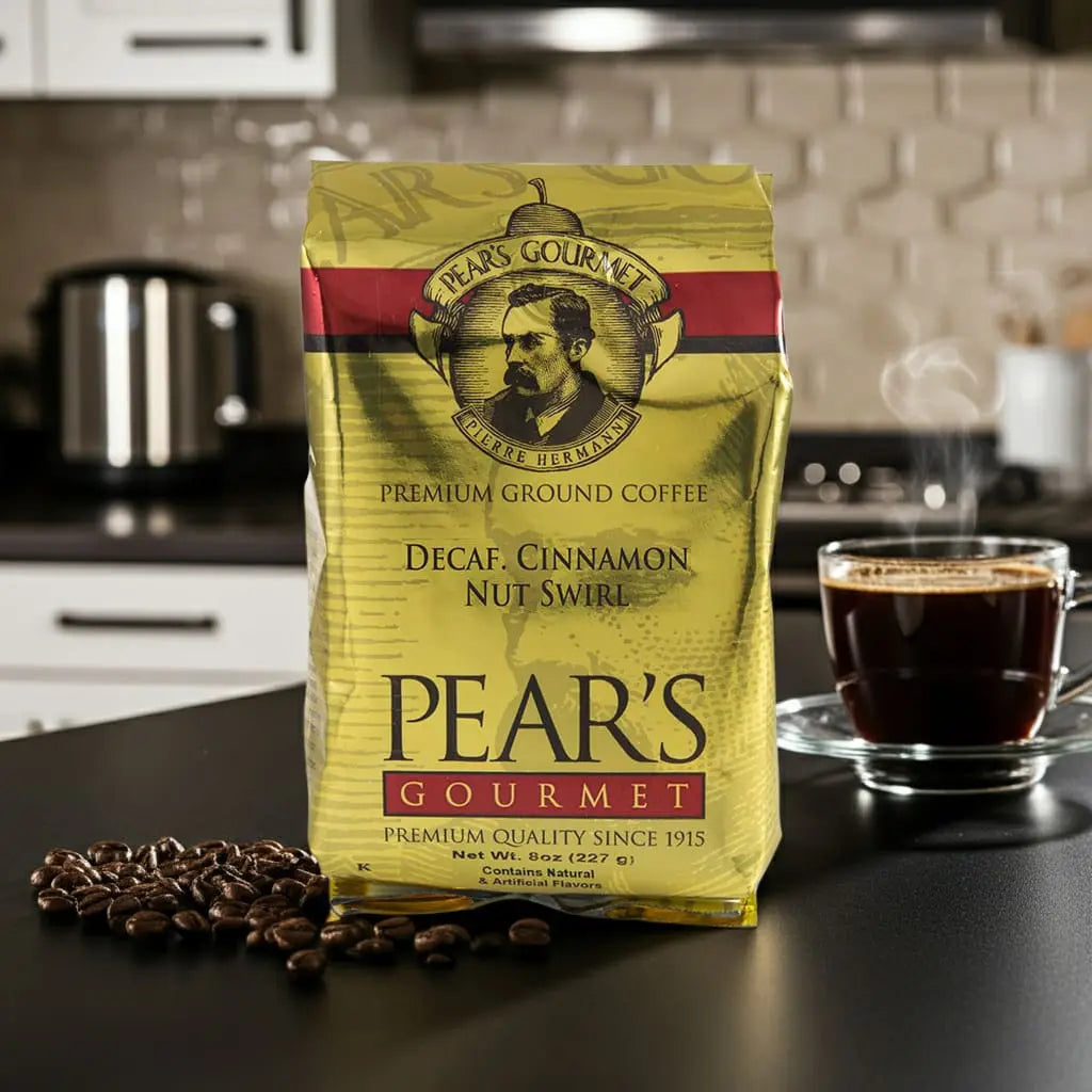 Pear's Gourmet coffee package on a kitchen counter with a cup of coffee and coffee beans.