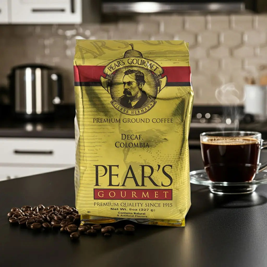 Pear's Gourmet coffee package with a cup of coffee and coffee beans on a kitchen counter.