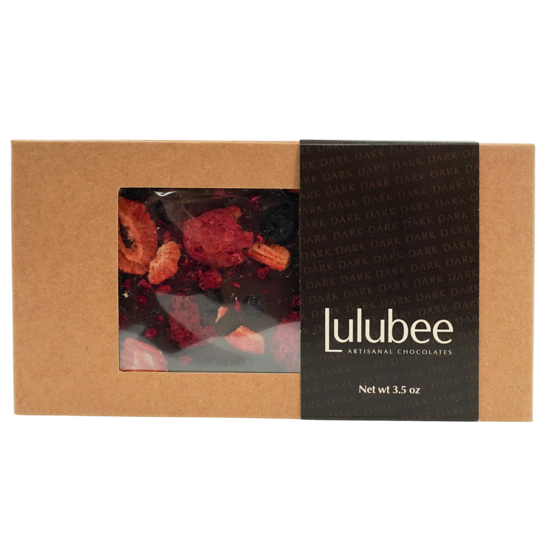 Lulubee chocolate packaging with a clear window showing dark chocolate covered with dried berries.