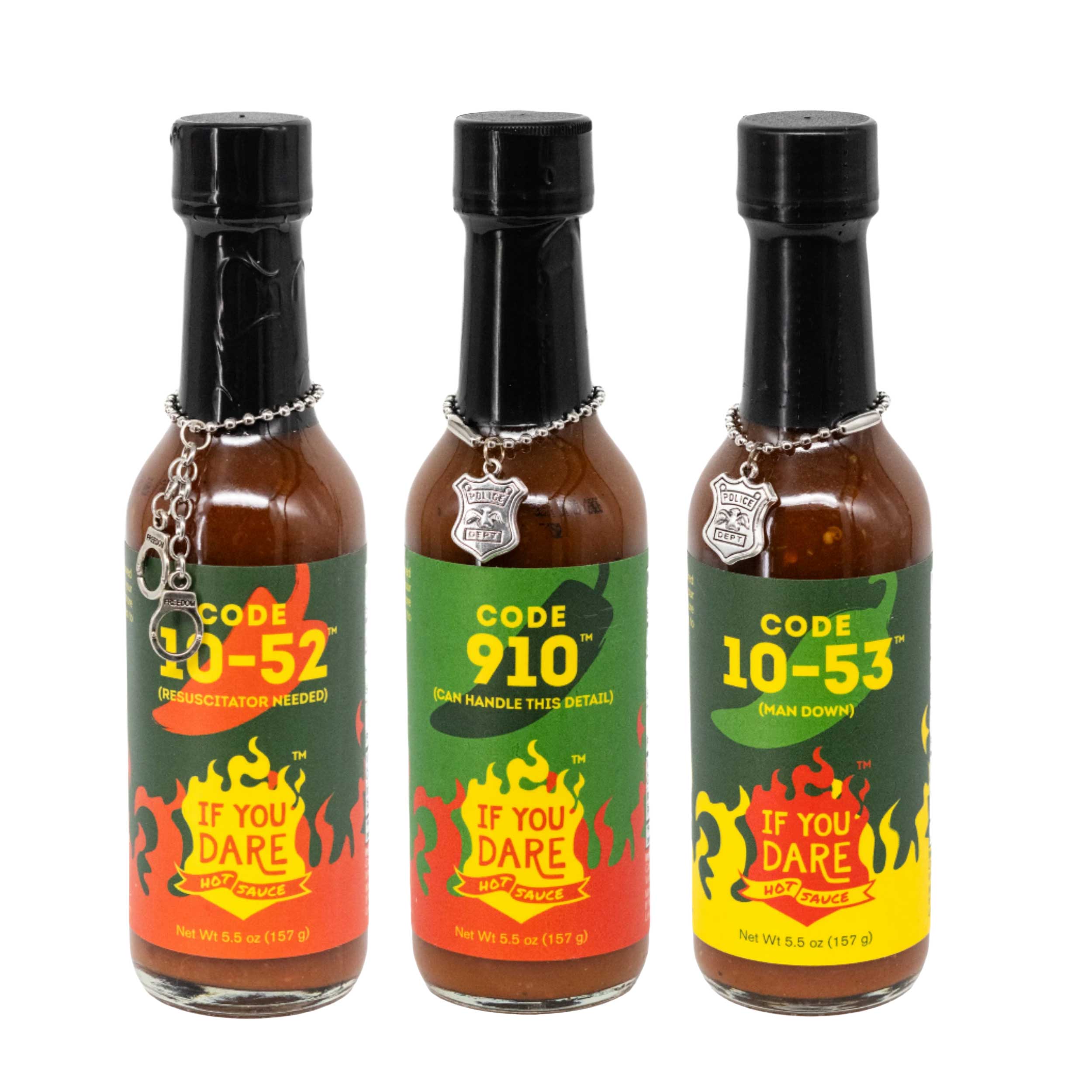 Three bottles of Code hot sauce with colorful labels on a white background