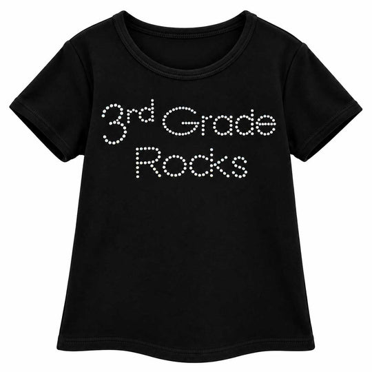 A black short-sleeve t-shirt with '3rd Grade Rocks' printed across the chest in white rhinestone-style lettering, shown on a plain white background.
