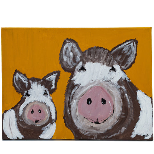 Two painted pigs on a mustard yellow background