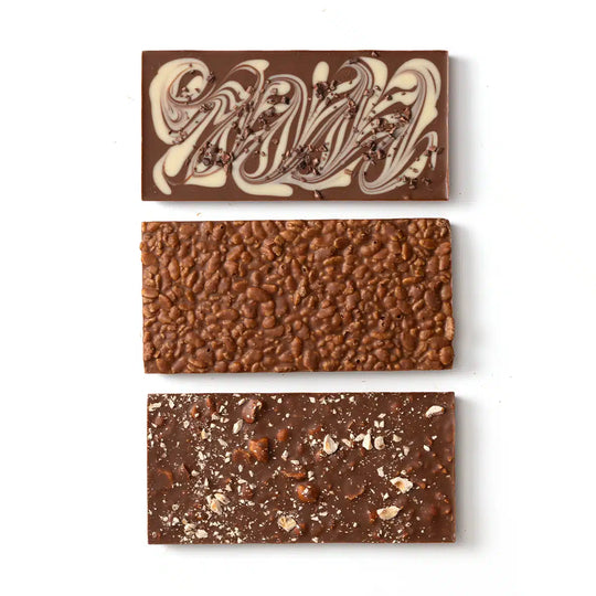 Three different chocolate bars with unique textures and designs on a white background