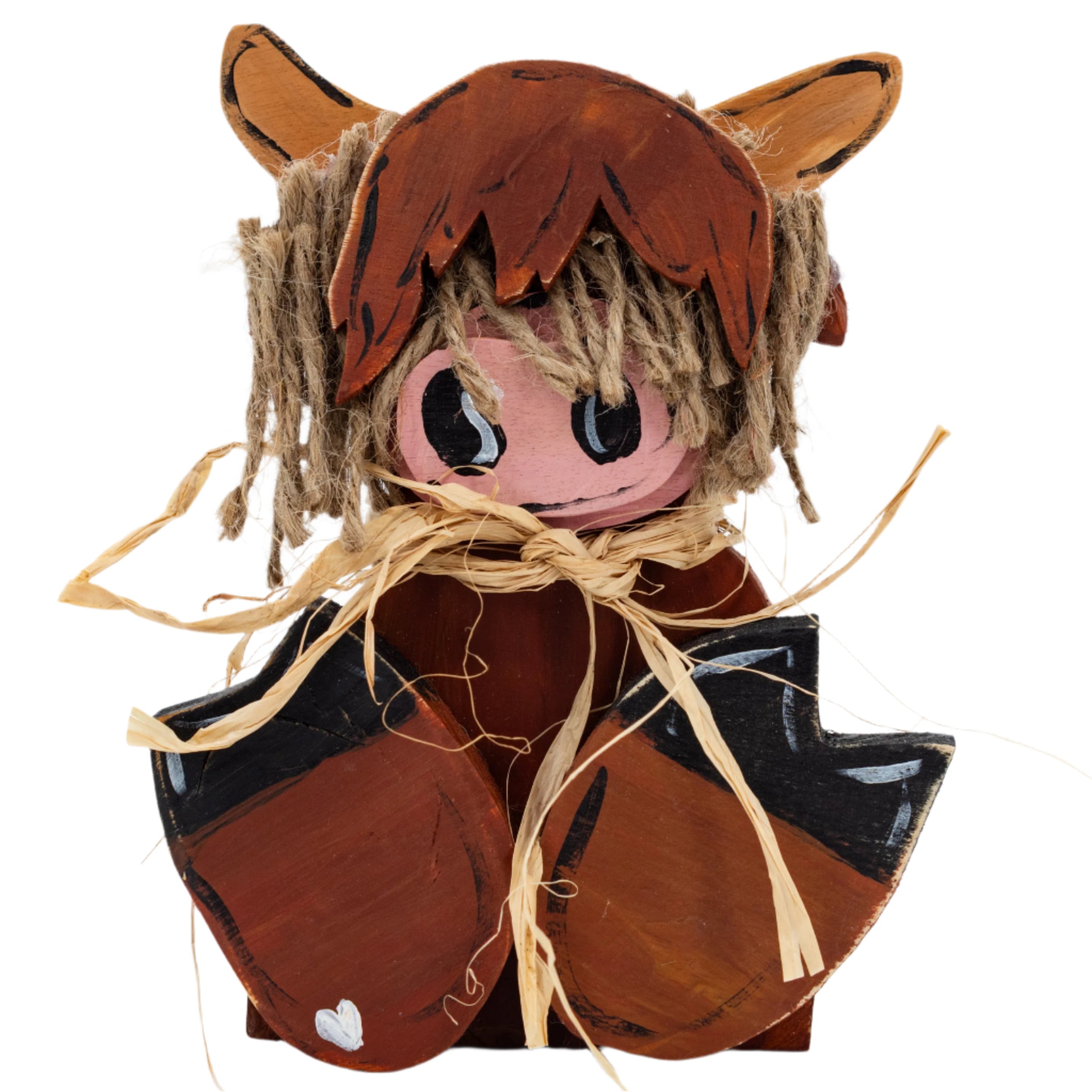 A rustic wooden decoration depicting a West Highland Cow with a brown body, black and white face, and straw accessories.