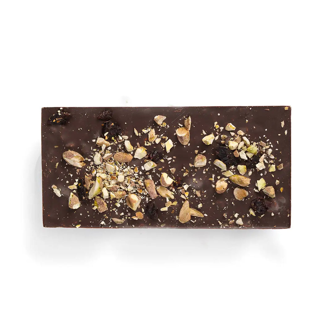 Dark chocolate bar with nuts on a white background