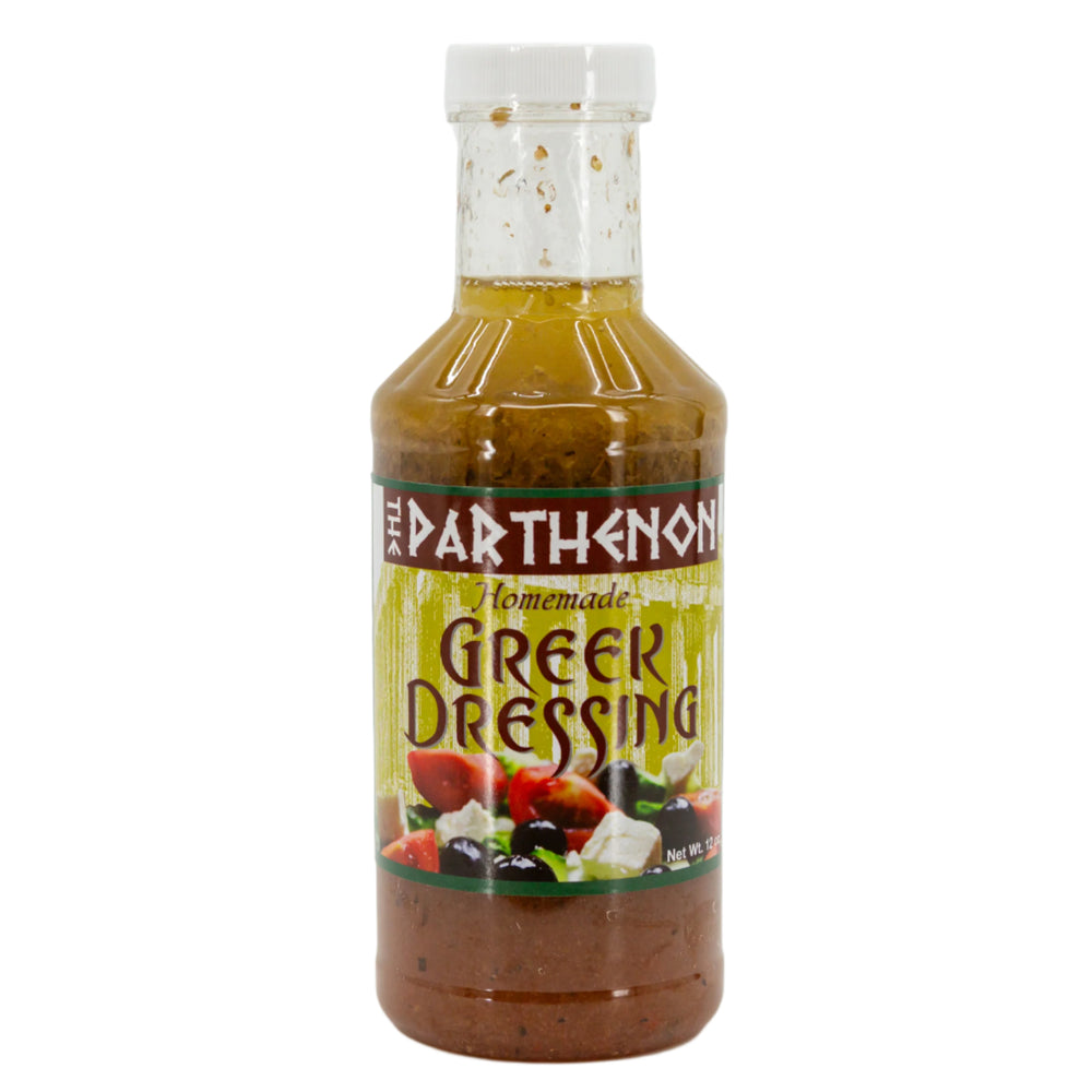 A bottle of The Parthenon Homemade Greek Dressing, 12 oz size, with a label depicting olives and feta cheese.