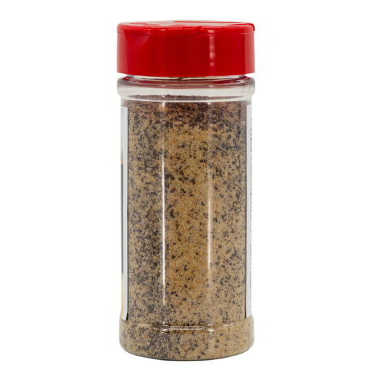 Clear spice jar with red lid on a white background