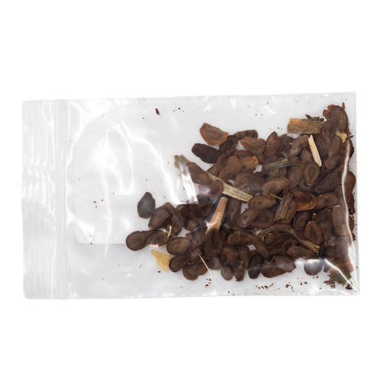 Clear plastic bag with dried mushrooms on a white background