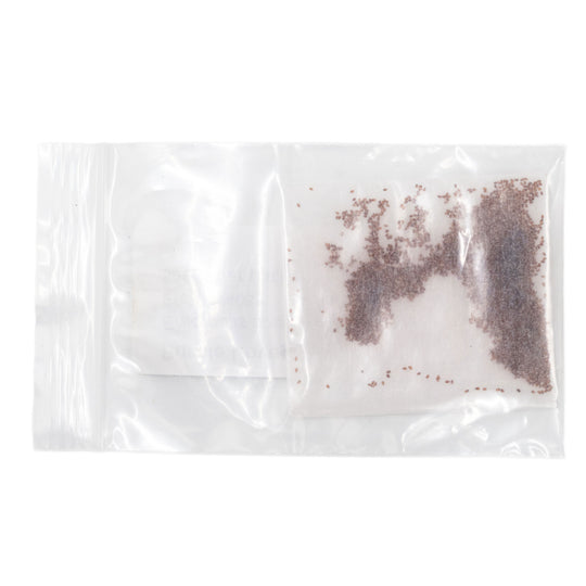 Clear plastic bag with brown and white powder on a white background