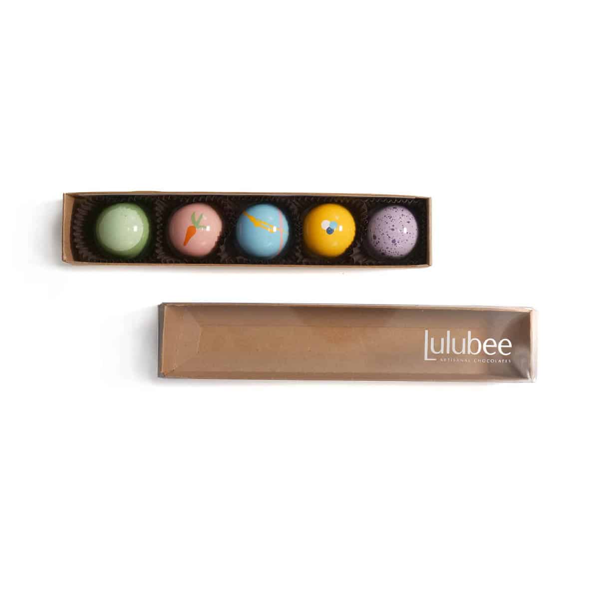 Set of colorful bon bons in a Lulubee box on a white background
