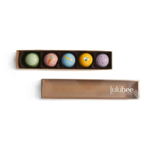 Set of colorful bon bons in a Lulubee box on a white background