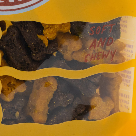 Packaged dog treats with 'Soft and Chewy' text on a yellow background