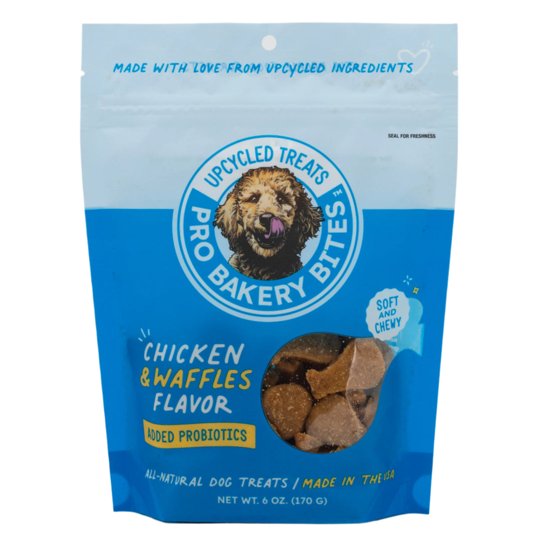 Blue package of Upcycled Treats Pro Bakery Bites with a dog's face on the label.