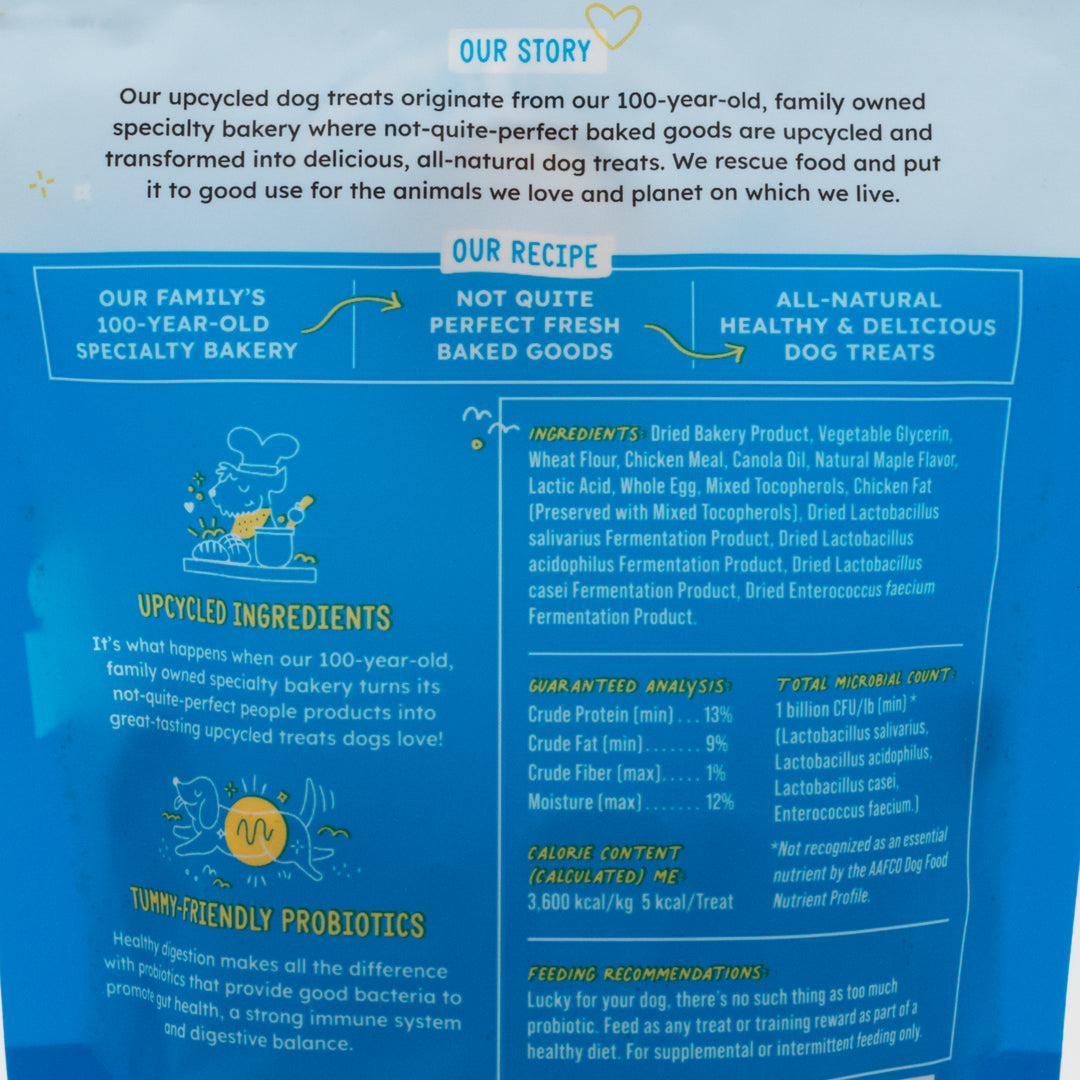 Dog treat packaging with 'Our Story' and 'Our Recipe' sections on a blue background.