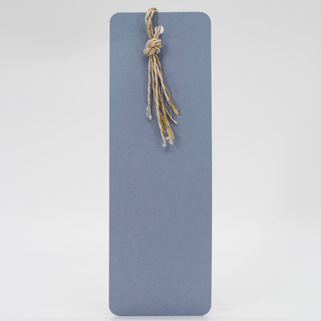 Blue rectangular mat with a knotted rope on a light gray background