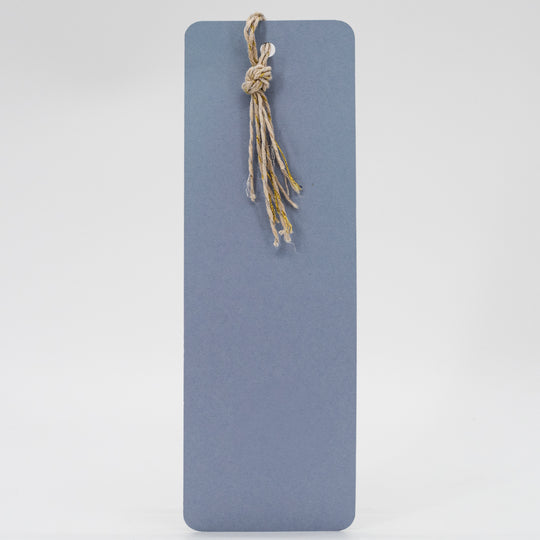 Blue rectangular mat with a knotted rope on a light gray background