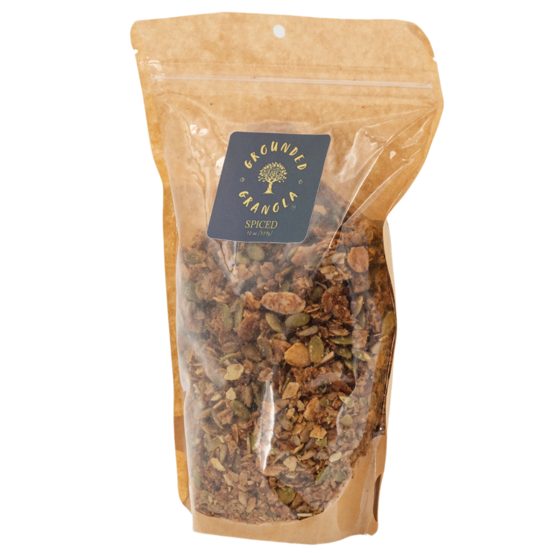 Bag of spiced granola with a visible brand label on a white background