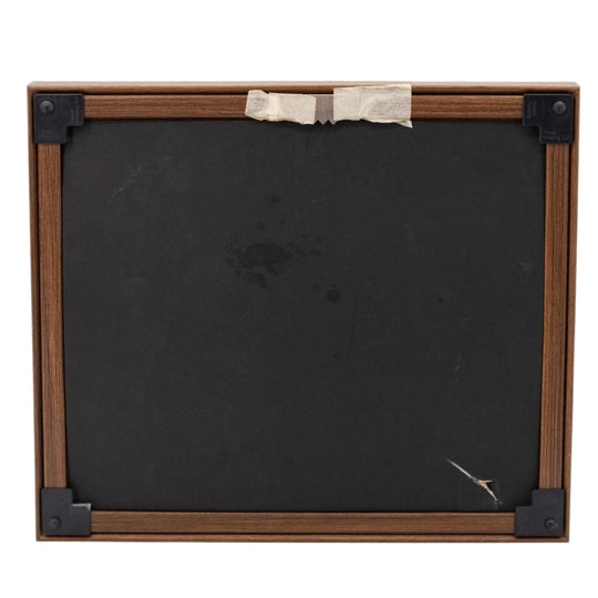 Wooden picture frame with a black backer on a white background