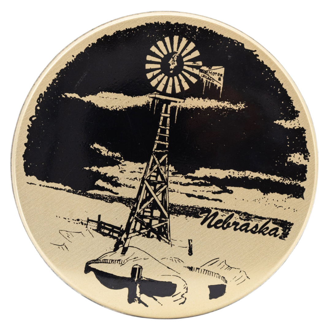 Decorative tin with a windmill and 'Nebraska' text on a black background