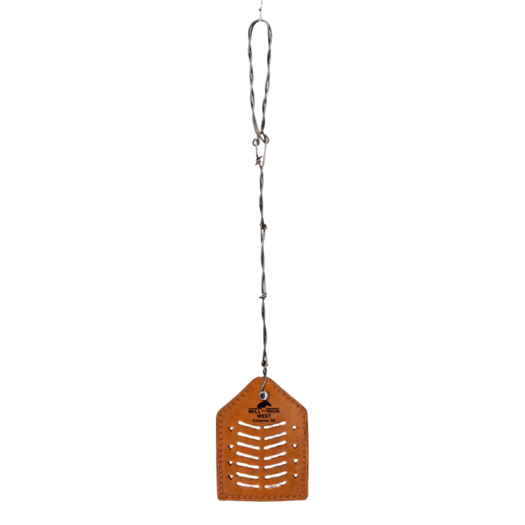 Brown leather fly swatter with a barbed wire grip on a white background