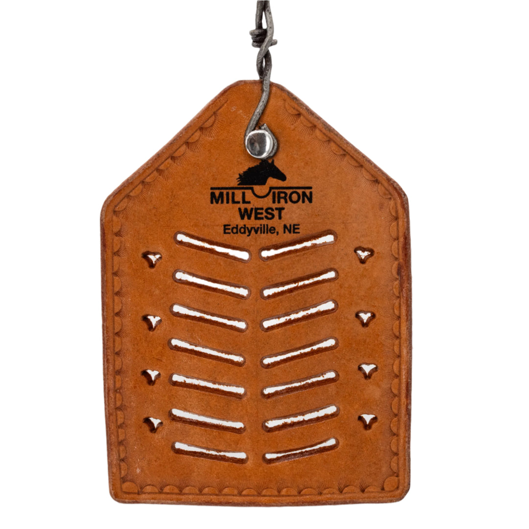 Brown leather tag with cut-out patterns and 'Mill Iron West' branding on a white background
