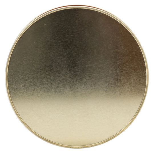 Round metallic object with gradient color on a white background
