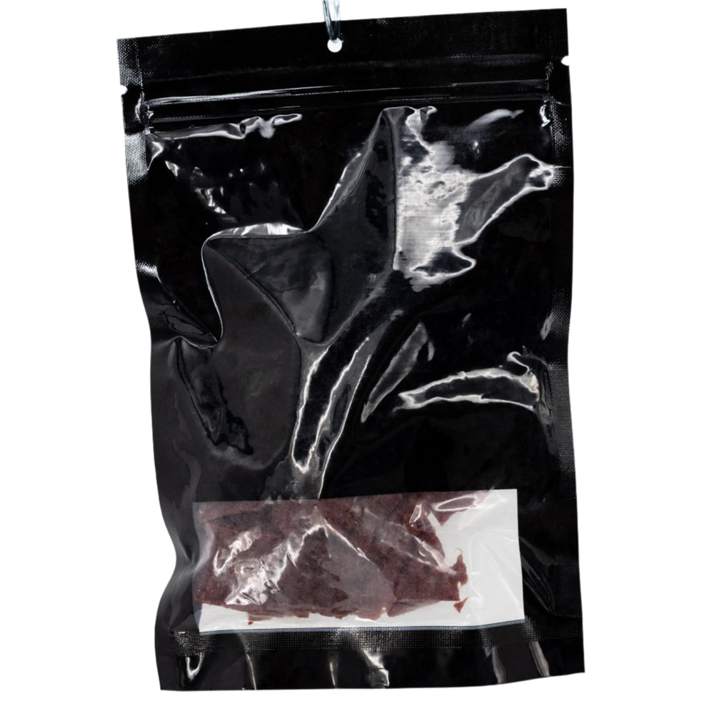 Black bag with jerky inside on a white background