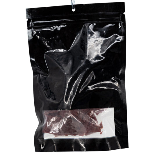 Black bag with jerky inside on a white background