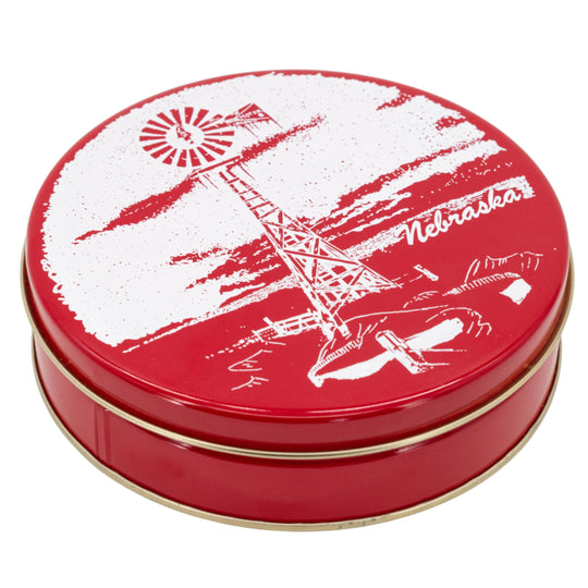 Red tin with white graphic design on a white background