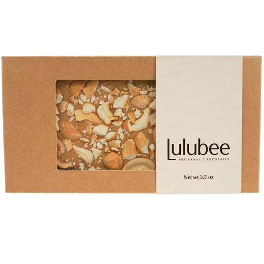 Lulubee artisanal chocolates in a brown box with visible nuts on a white background